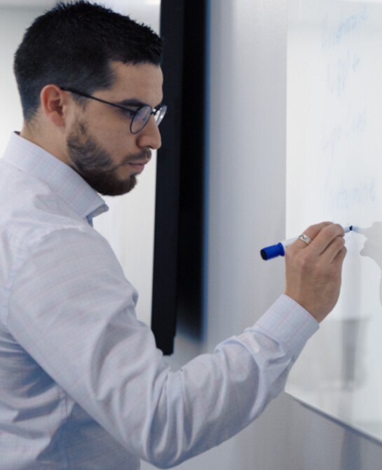 Business Professional at Whiteboard